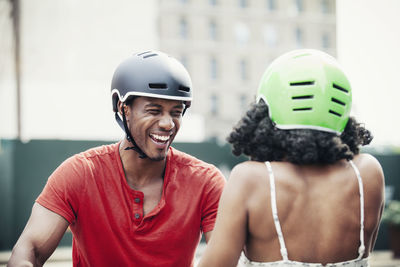 Cheerful man looking at woman