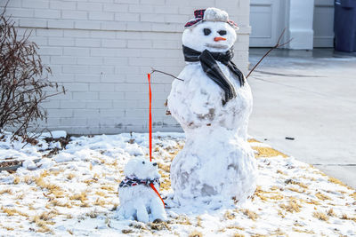 Toy on snow covered park during winter