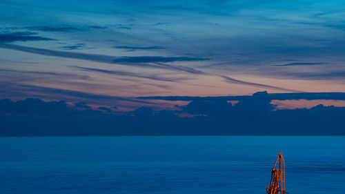 Scenic view of sea against sky at sunset