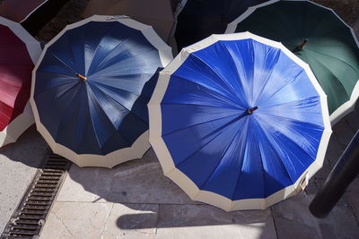 High angle view of various umbrellas on street