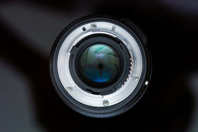 Close-up of camera lens on table