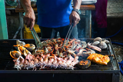Street food on phu quoc island in vietnam. delicious seafood for tourist at market at night.