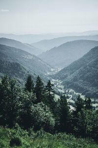 Scenic view of landscape and mountains against sky