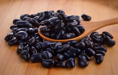 Close-up of black coffee beans on table