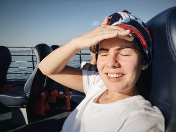 Young woman smiling on ferry