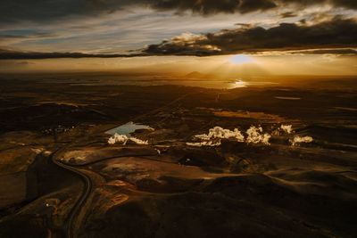 Aerial view of sea against sky during sunset