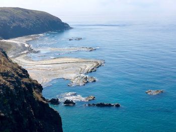High angle view of sea shore against sky