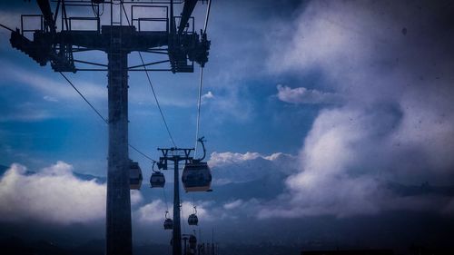 Low angle view of electricity pylon against sky