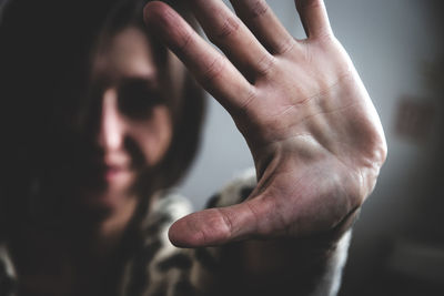 Close-up of woman showing stop gesture