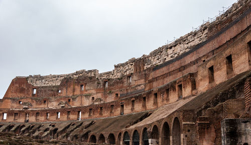 Low angle view of old ruins against sky