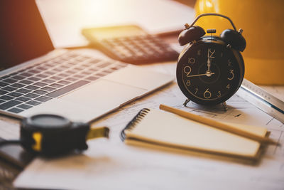 High angle view of clock on table