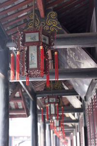 Low angle view of lantern hanging in building