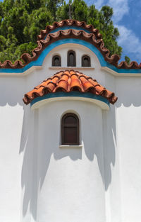 Low angle view of white building against sky