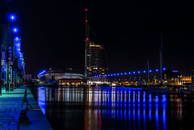 Illuminated city at waterfront