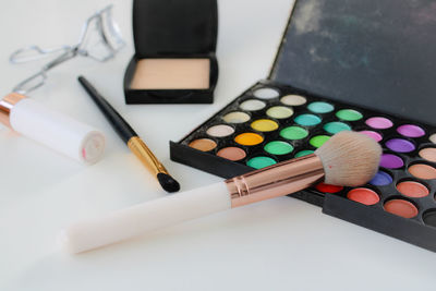 High angle view of make-up on table