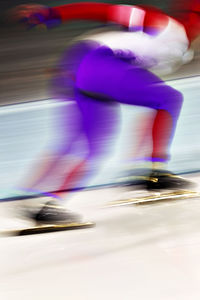 Low section of skater in skating ring