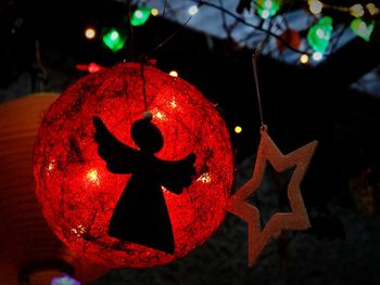 Close-up of christmas decoration hanging at night