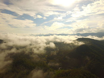 Low angle view of clouds over mountain