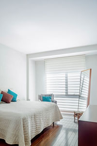 Bedroom, room, in the background you can see a bathroom, with mirrored sliding door, wooden door