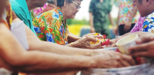 Midsection of people during traditional festival