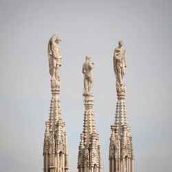 Low angle view of statue against sky