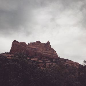 Low angle view of rock formations against sky