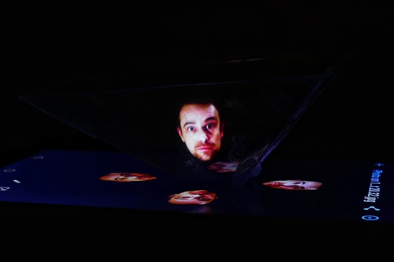 PORTRAIT OF YOUNG MAN IN DARK