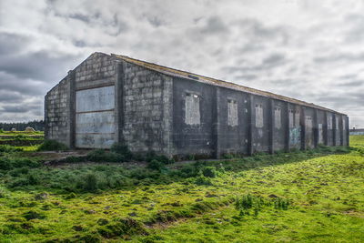 House on field against sky