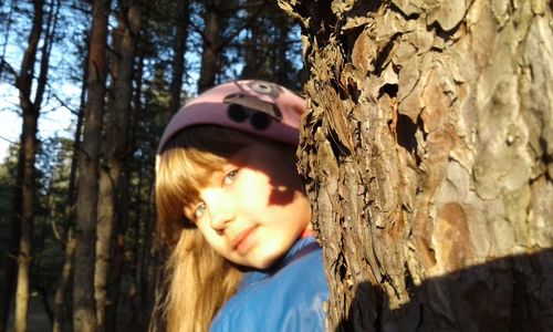 Portrait of young woman in park