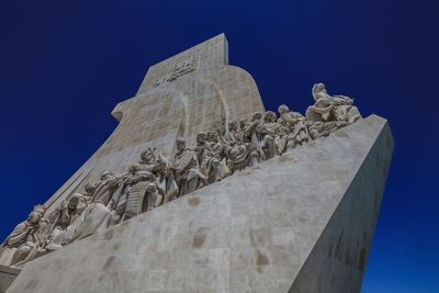 Low angle view of statue against sky