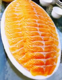 Close-up of orange slice in plate on table