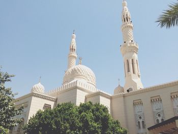 Low angle view of built structure against clear blue sky