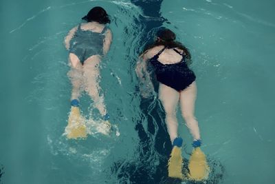 High angle view of women swimming in pool