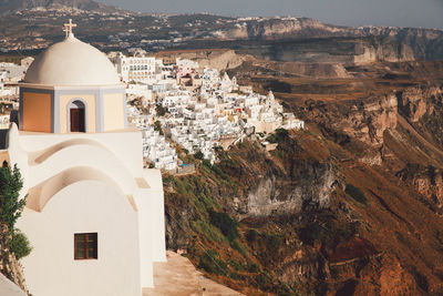 Church and buildings in city at santorini