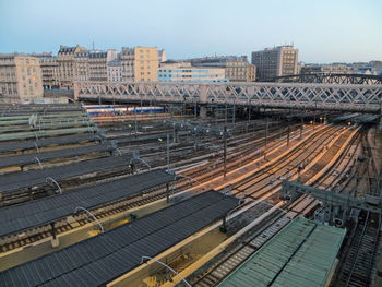 High angle view of railroad tracks in city against sky