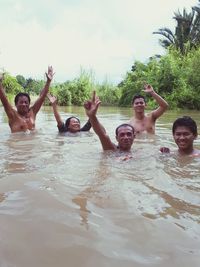 High angle view of people enjoying in water