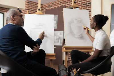 Side view of business colleagues working at home