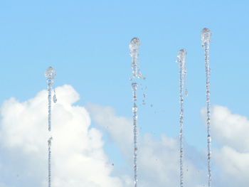 Low angle view of vapor trail against blue sky