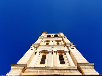 Low angle view of building against blue sky