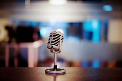 Close-up of microphone on table