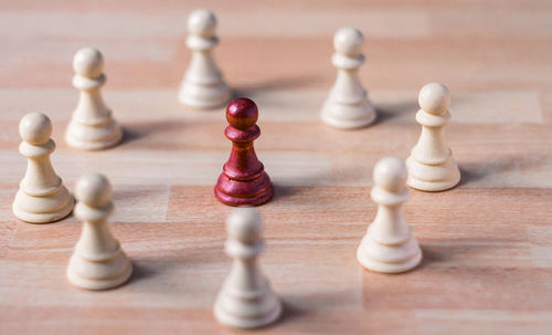 Close-up of chess pieces on table