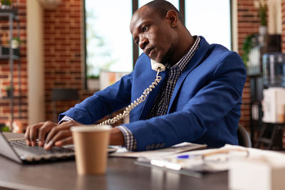 Busy businessman working in office