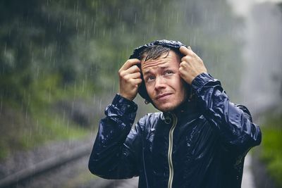 Portrait of man in rain