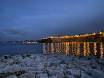 Scenic view of sea against sky at dusk