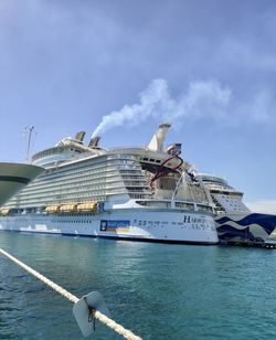 Ship sailing in sea against sky