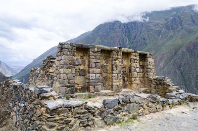 Stone wall with mountain range in background