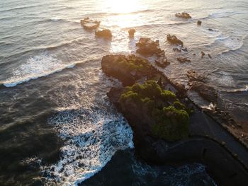 High angle view of rocks in sea