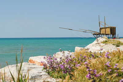 Scenic view of sea against blue sky