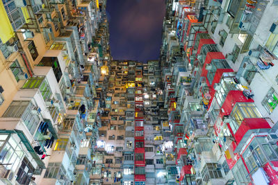 Low angle view of illuminated buildings in city