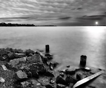 Scenic view of sea against cloudy sky